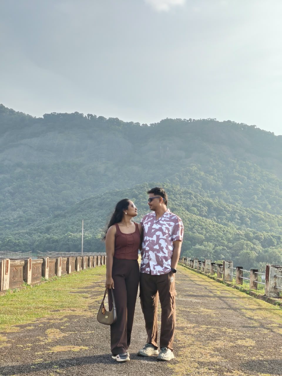 A walkway framed by the Nelliyampathy hills.