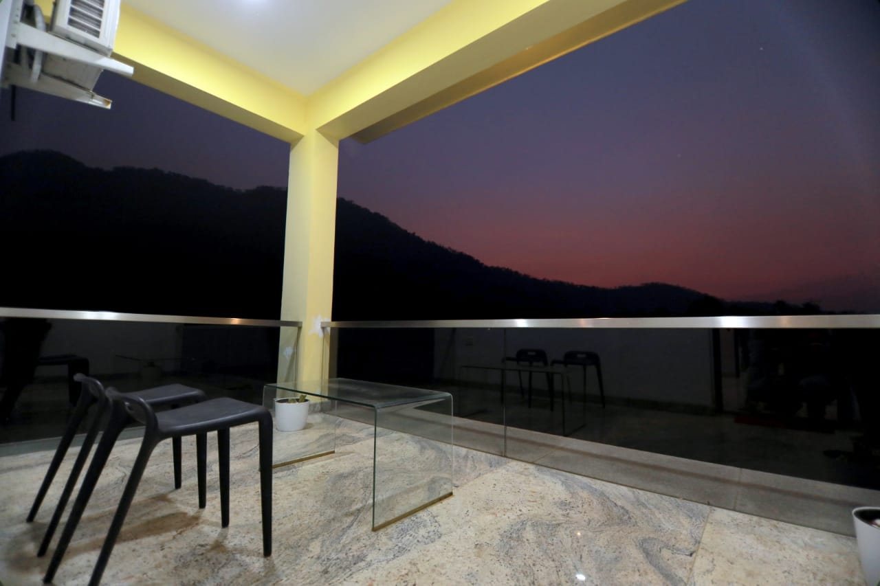 A balcony overlooking the hills.